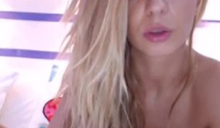 Beautiful blonde playing with vibrator in front of the livecam