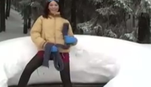 It's so cold outside as this brave hoe masturbates while laying on the snow